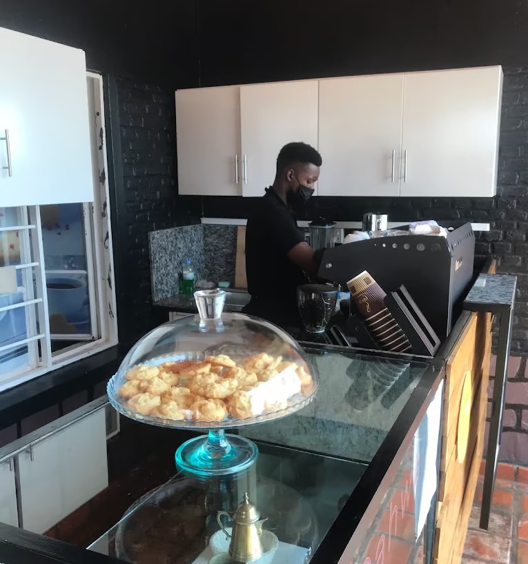 Barista preparing coffee at Qahwa House